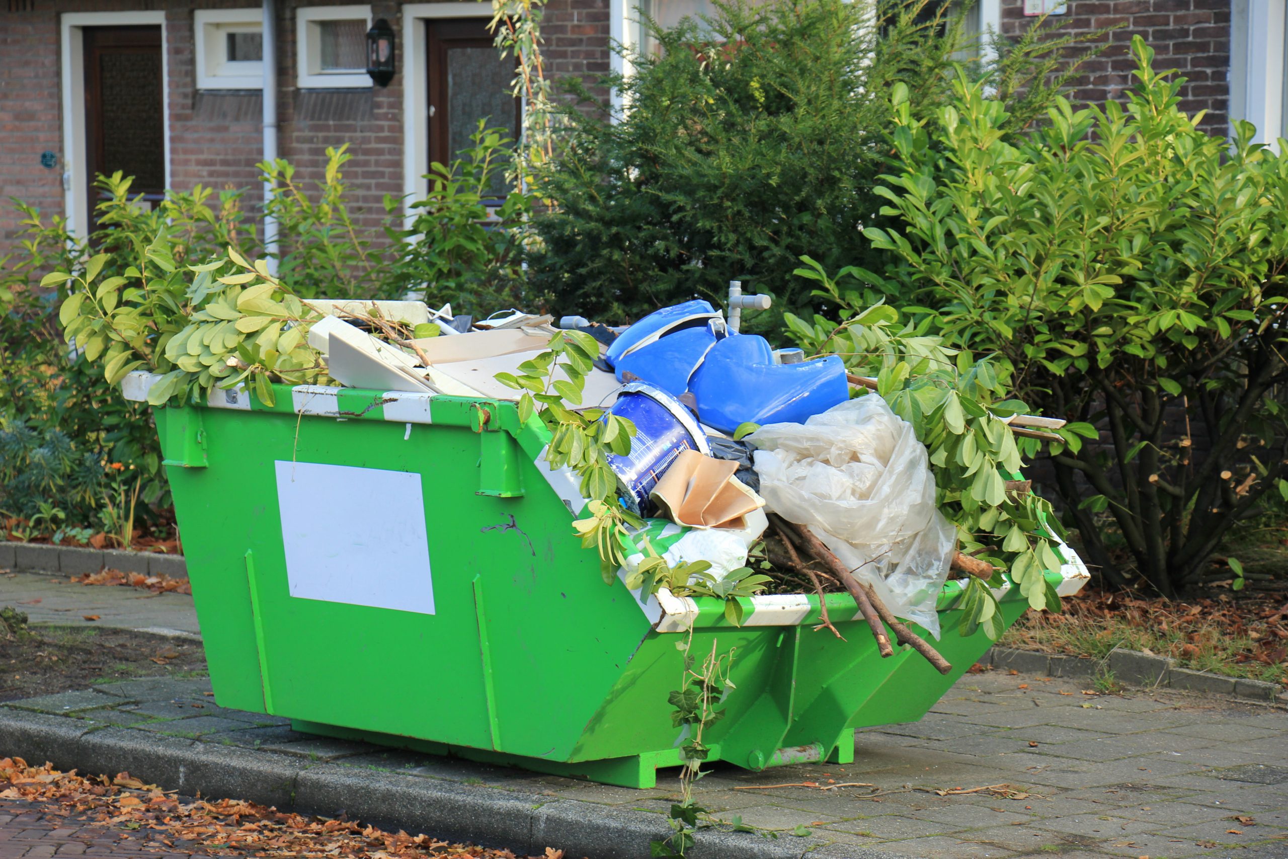 Loaded waste in mini skip
