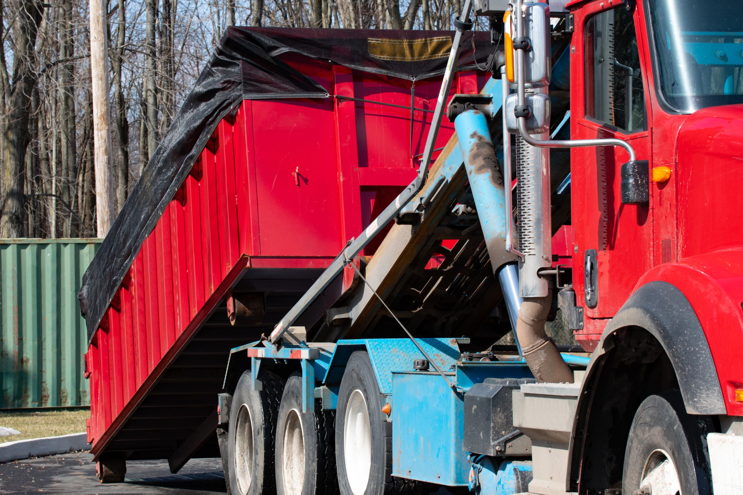 truck loading a full roro skip recycling garbage waste management container